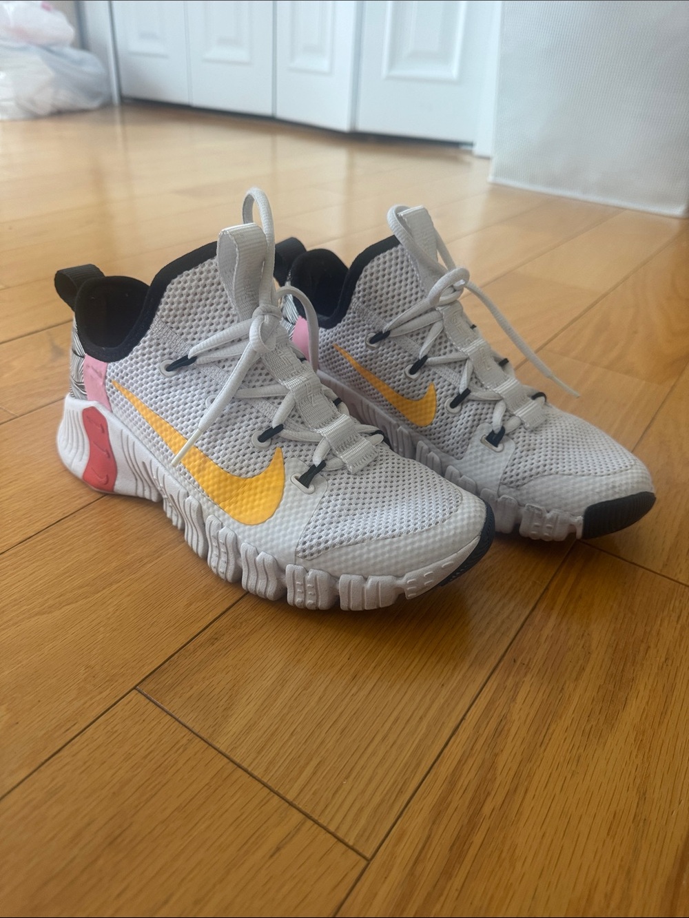 Nike White Mesh Trainers with Yellow Swoosh and Pink Accents